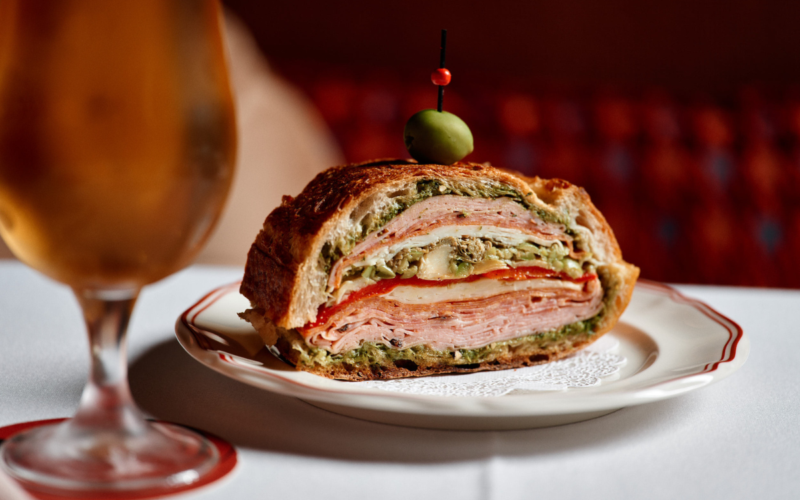 Muffuletta Panini with shot of beer